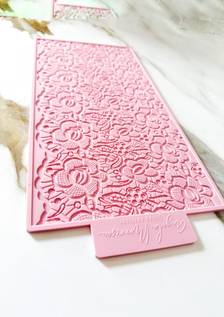 Edible lace created with floral silicone lace mat for cake decorating.
